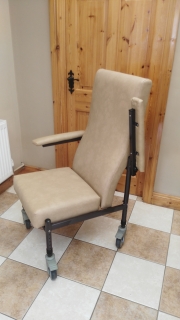Orthopaedic chair on Castors with side transfer arms